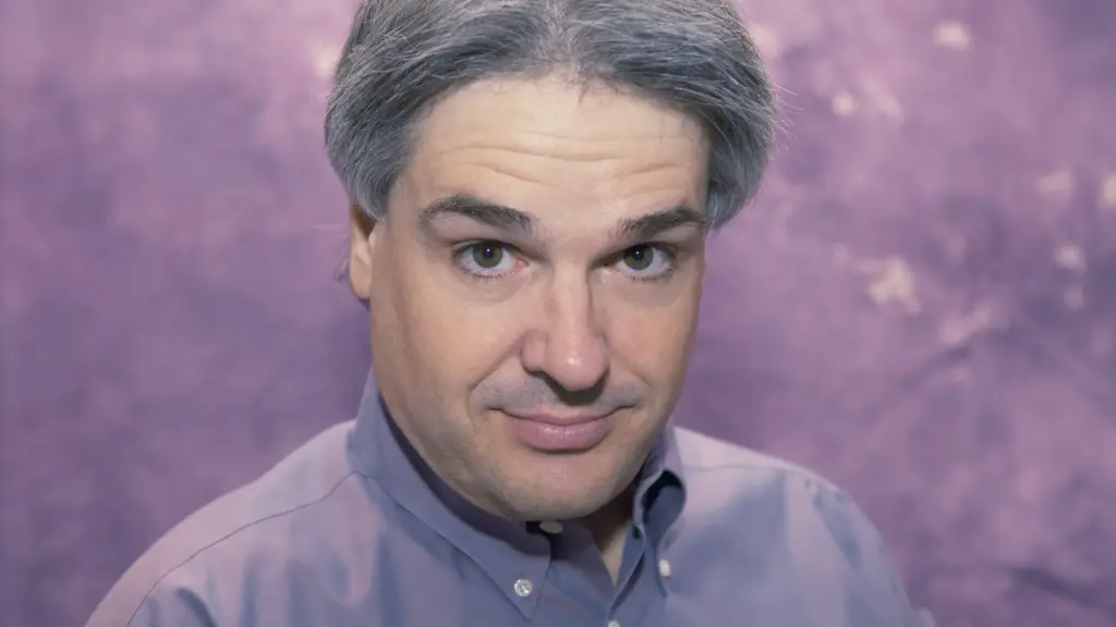 Head shot of a distinguished man looking directly into the camera.